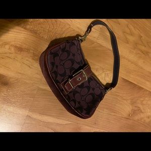 Small, plum Coach purse